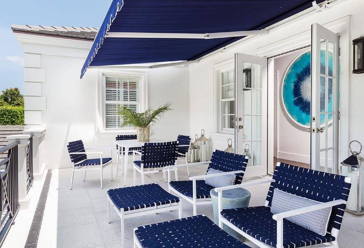 A Blue And White Balcony Design With Multifunctional Furniture